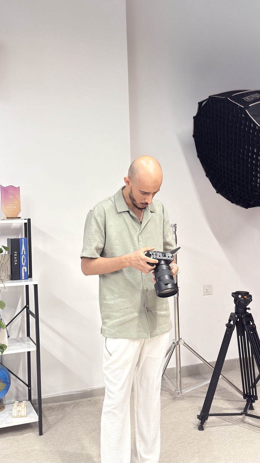 Samer Hameed working with a camera in a studio